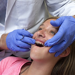 Teen with braces being fitted for a retainer