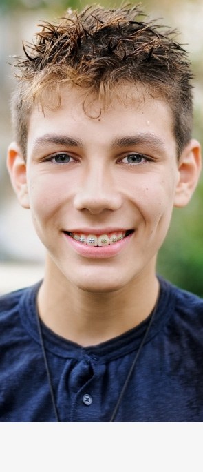 Teen boy with self-ligating braces