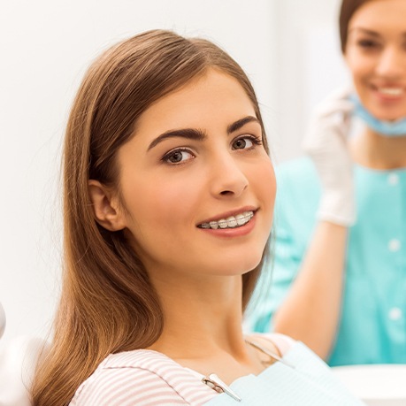Orthodontic patient smiling in treatment chair