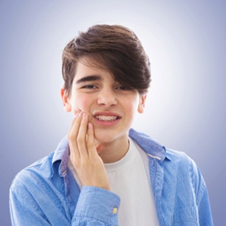 Boy in denim jacket with orthodontic emergency in Cumming, GA