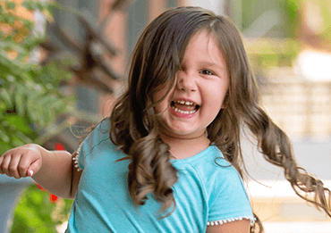 Little girl smiling after dentofacial orthopedics visit