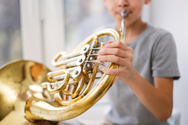 Playing French horn