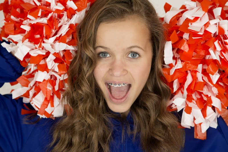 female cheerleader with braces 