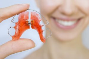 woman holding retainer