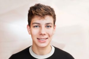 smiling teenager with braces 