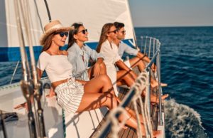 friends smiling on a boat 