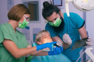 dentist showing patient her x-ray