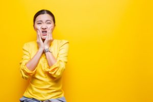 Woman with braces uncomfortable 