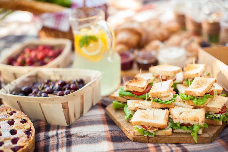 Foods laid out for an outdoor picnic