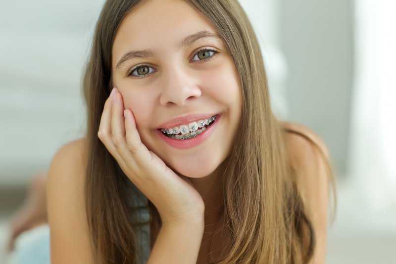 a young girl wearing braces 