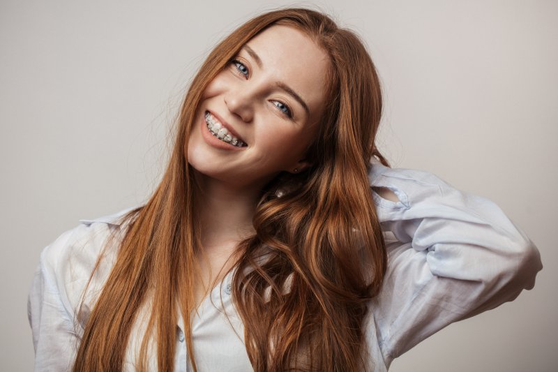 Smiling teen wears braces
