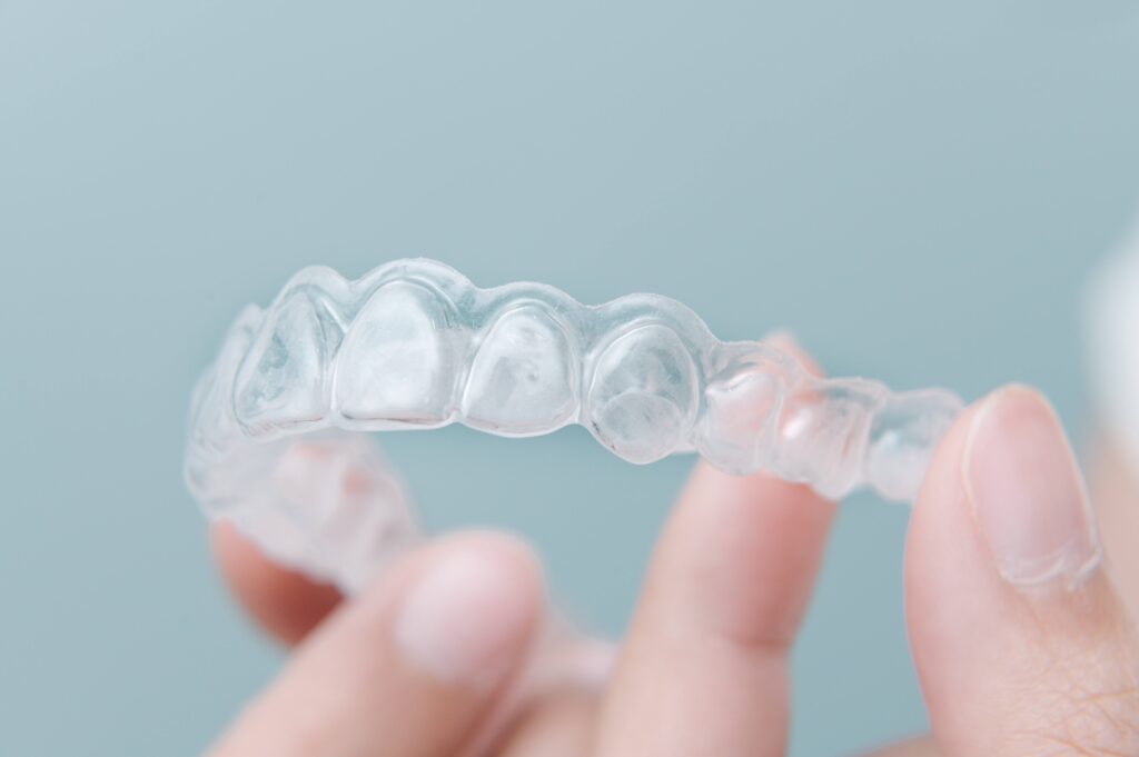 Patient holding clear aligner