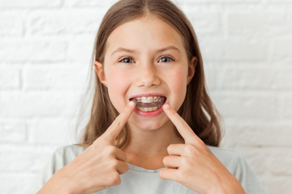 A little girl with braces.