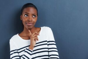 Woman wearing curious, thoughtful expression
