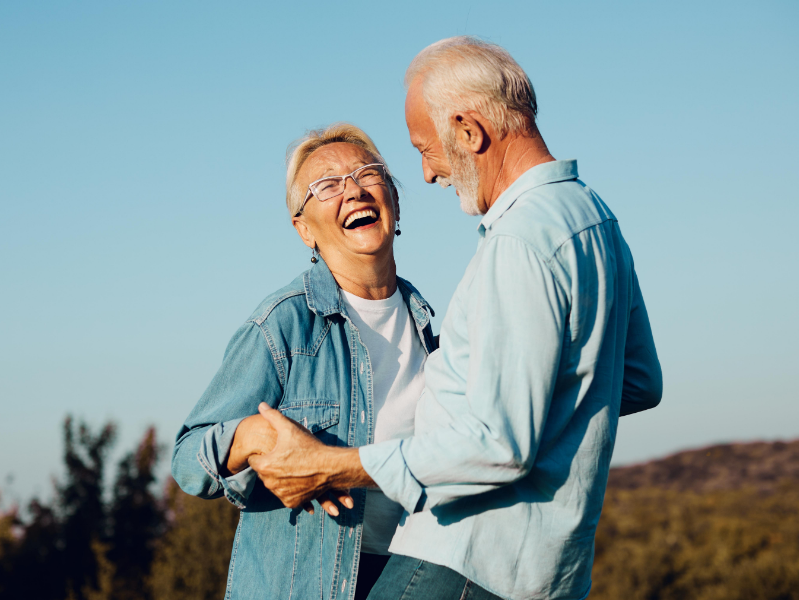 Senior couple smiling and dancing